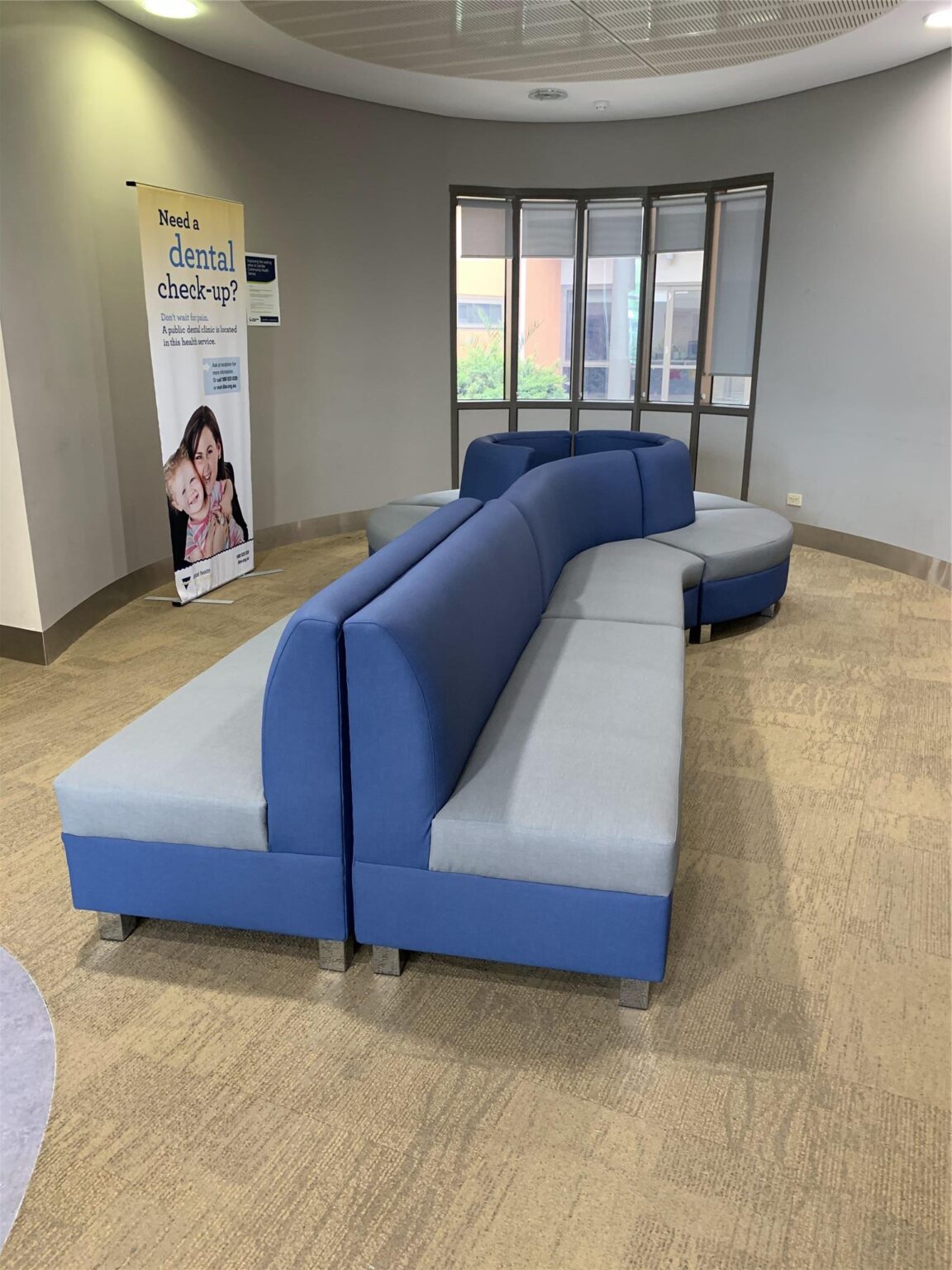 Curved modular seating upholstered for a community health clinic by EFI Furniture