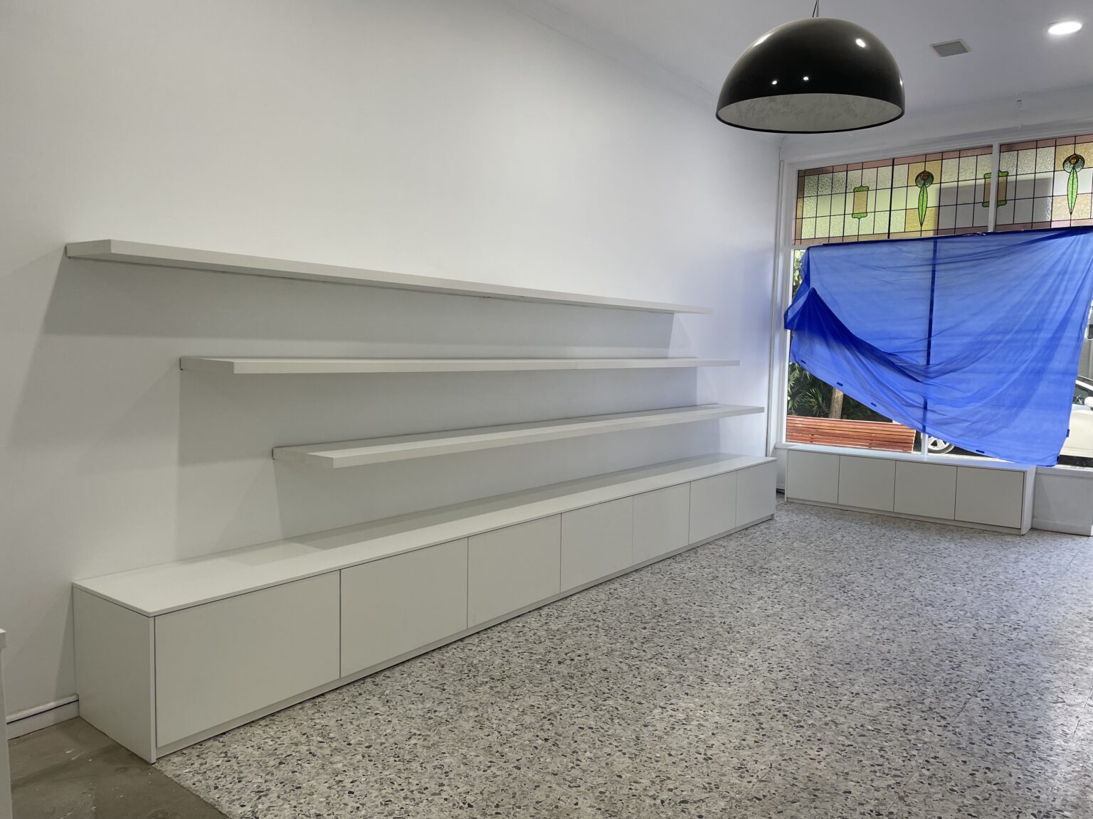 White retail display shelving and cabinetry fit-out by EFI Furniture