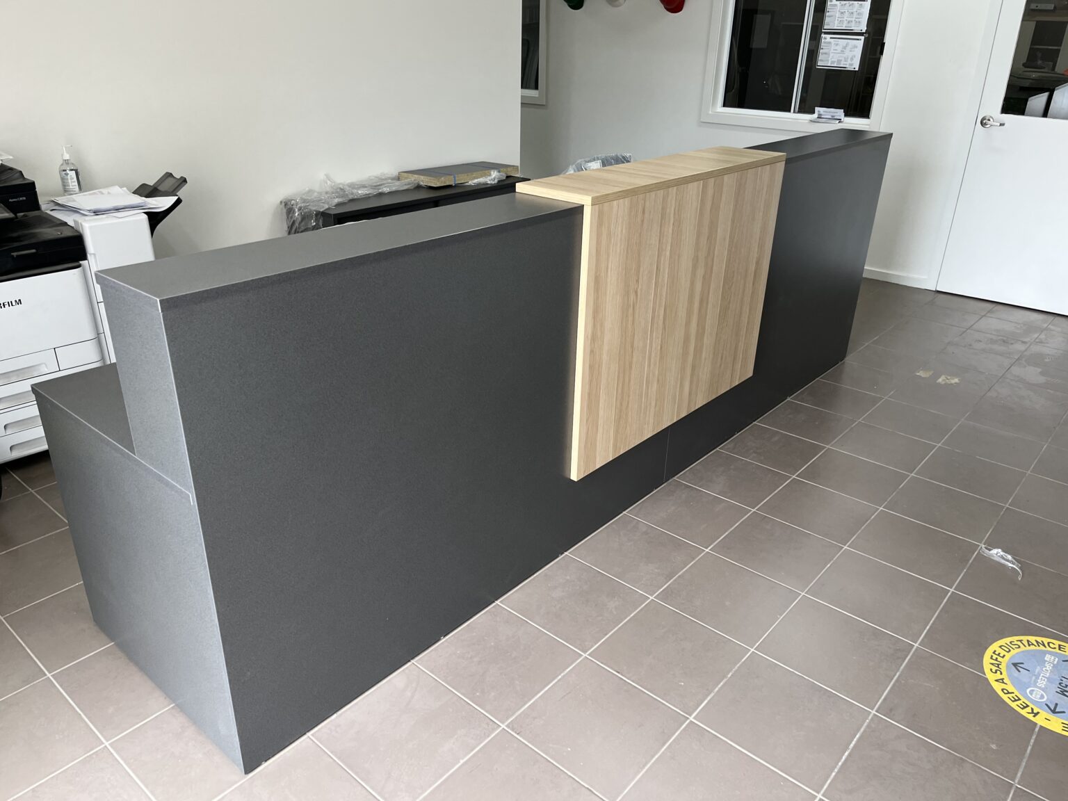 Charcoal and timber commercial reception desk by EFI Furniture