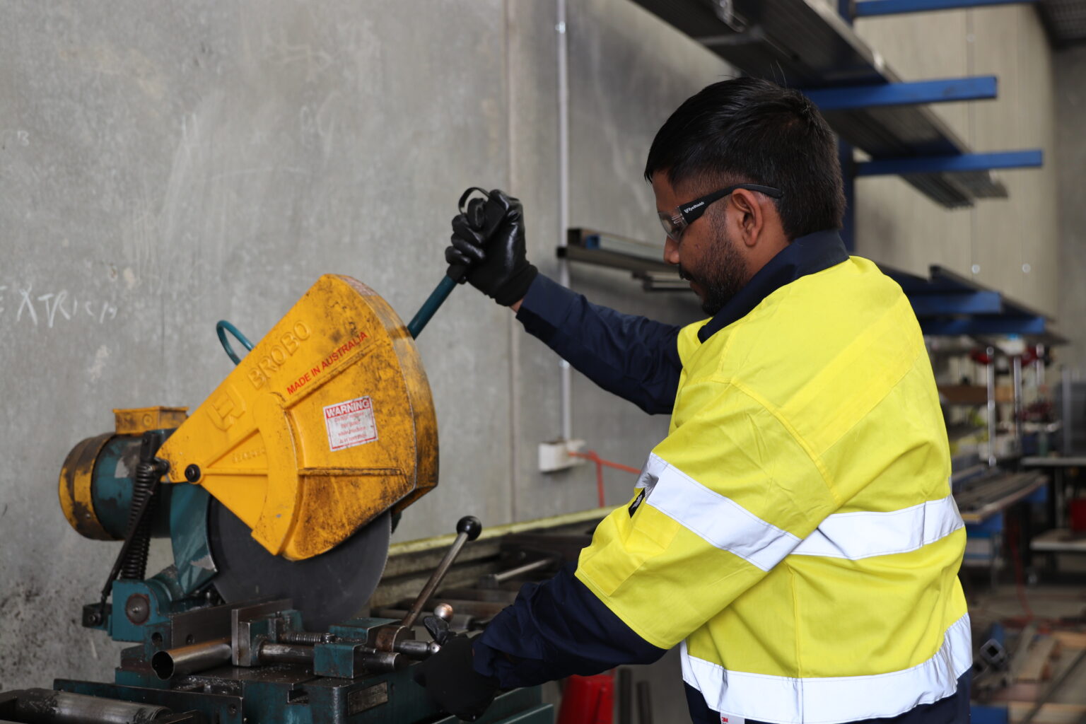Cutting steel to length on the cold saw at EFI Furniture