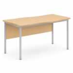 Develop Flag Table – flag-shaped teachers table with maple laminate top, modesty panel and silver powdercoat steel frame