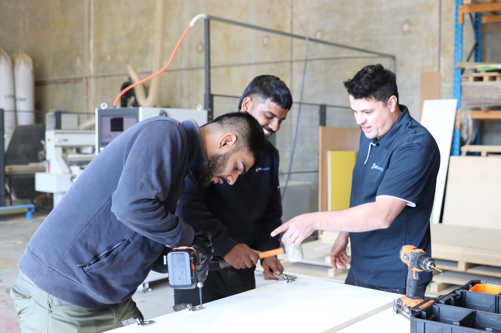 EFI Furniture team assembling custom commercial cabinetry